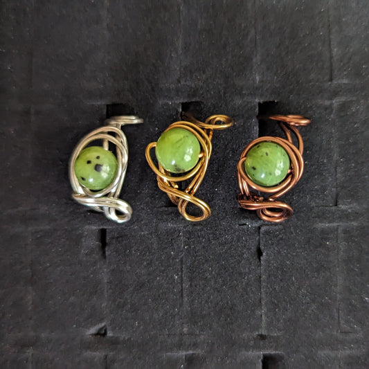 Jade Rings from left to right, Silver, Gold and Copper